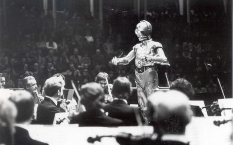 C3PO conducts the LSO at a special Star Wars concert at the Royal Albert Hall, 1978