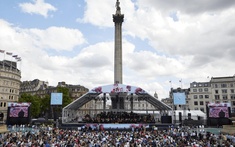 A temporary stage and large audience in Trafalgar Square